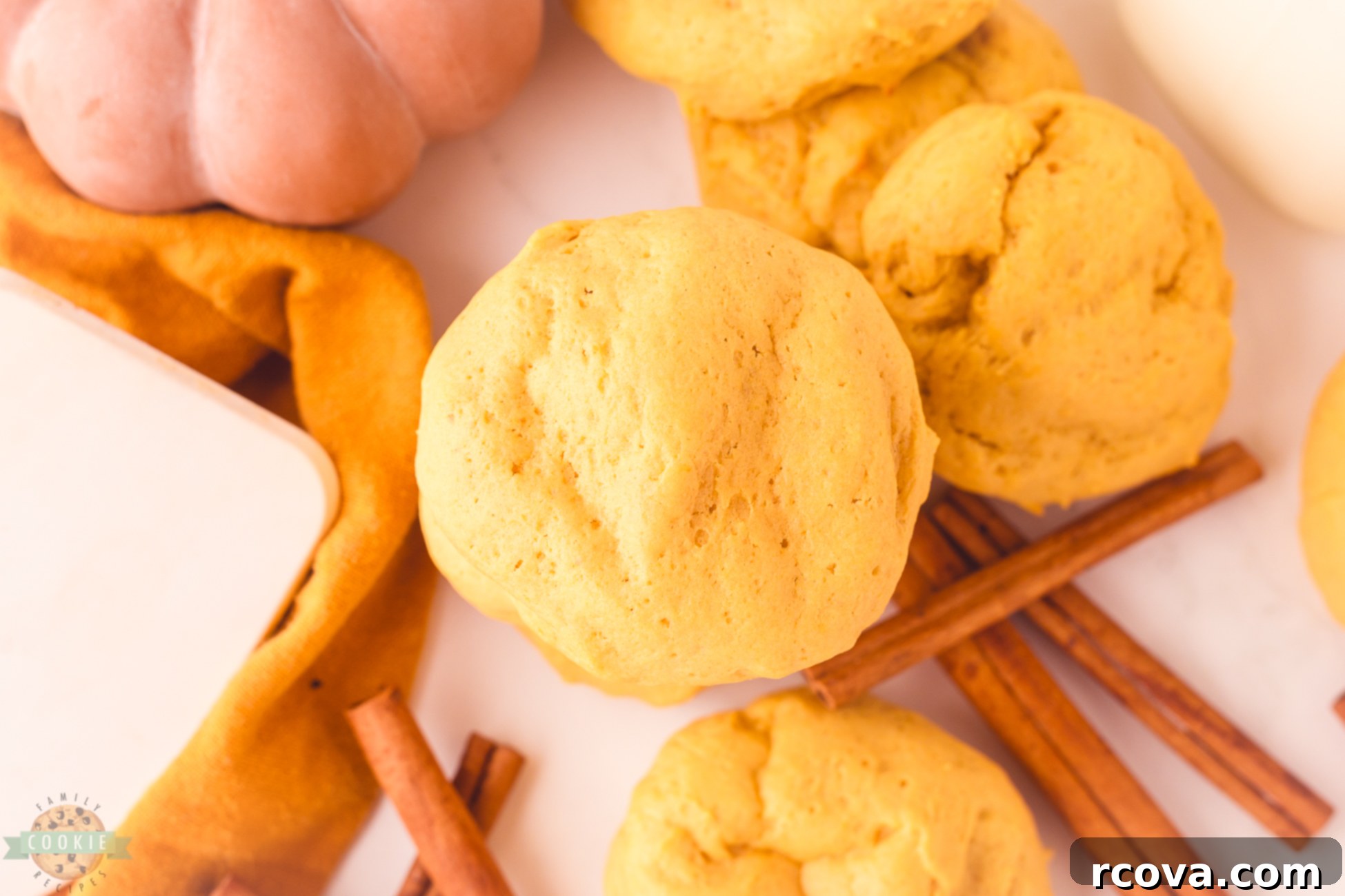 Pumpkin Cookies with a Creamy Cheesecake Core 4 soft pillowy pumpkin cookies with cheesecake filling, fall cookie recipe