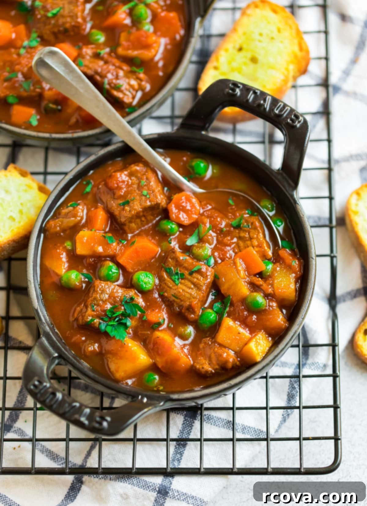 20 No-Fuss Slow Cooker Soup Recipes 14 A hearty bowl of Crockpot Beef Vegetable Soup, rich with chunky vegetables and tender beef.