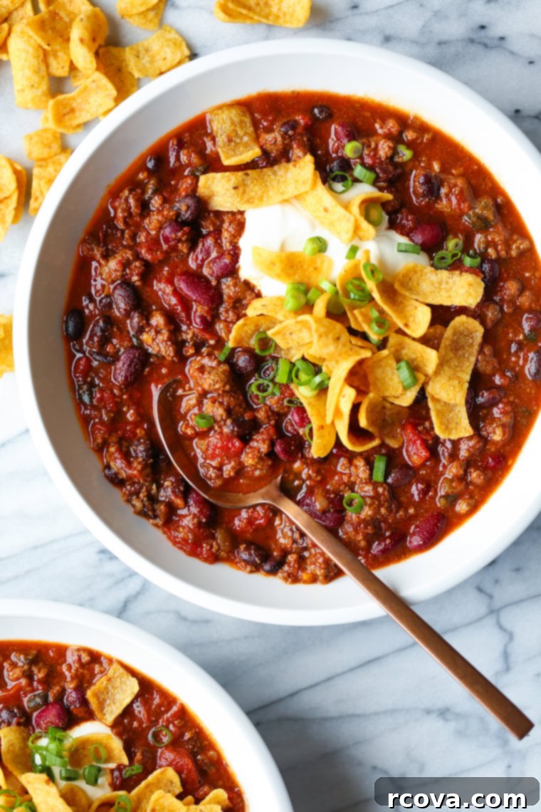 20 No-Fuss Slow Cooker Soup Recipes 22 A piping hot bowl of classic crockpot chili, topped with cool sour cream and crispy tortilla strips.