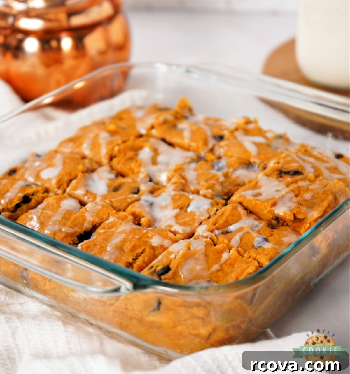 Cozy Autumn Pumpkin Chocolate Chip Bars 7 Delicious and easy pumpkin dessert bars cut into squares with a light glaze drizzle, perfect for fall.
