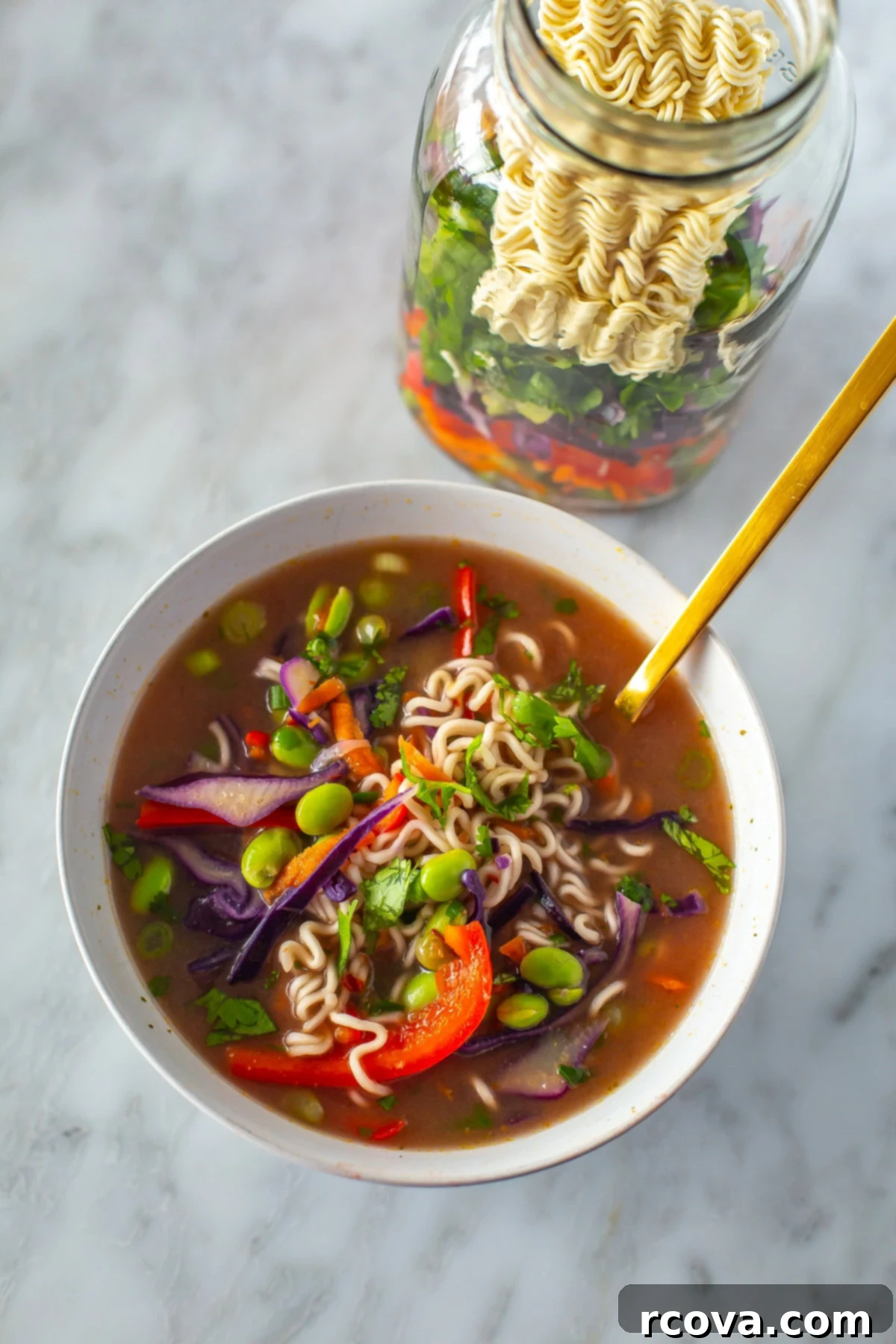 Homemade Instant Noodle Perfection 8 One mason jar of homemade instant noodles, with another serving already poured into a white bowl, ready to be enjoyed, highlighting the ease of preparation.