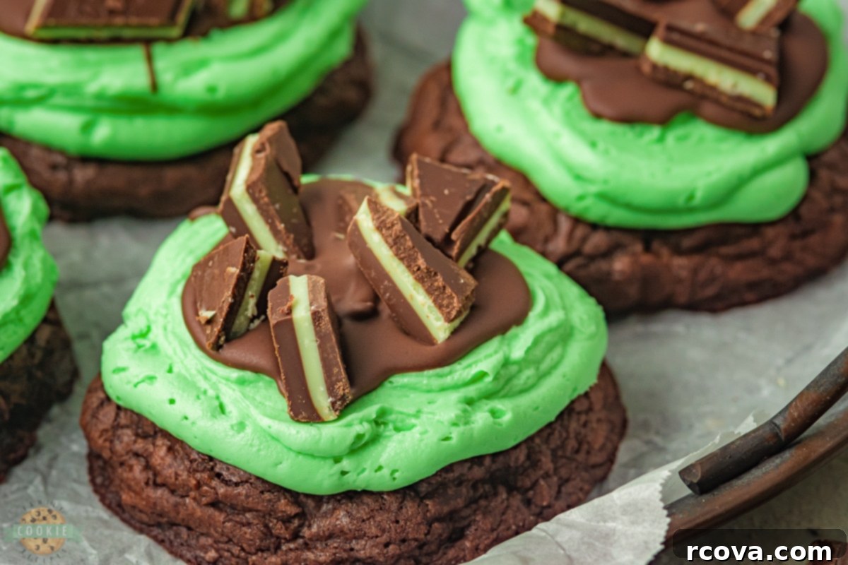 Grasshopper Delights 2 Close-up of a stack of Grasshopper Cookies, showing the mint frosting and chocolate ganache layers.