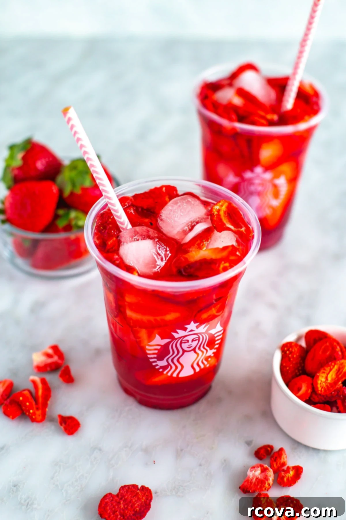 DIY Starbucks Strawberry Acai Refresher 8 An overhead shot of two glasses of Starbucks strawberry acai refresher.
