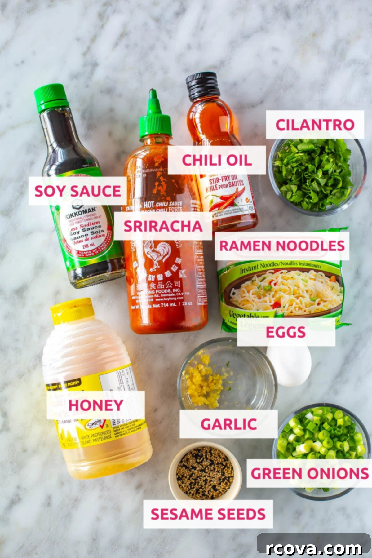 Quick Fiery Noodles 4 Ingredients for spicy noodles: ramen noodles, sriracha, chili oil, cilantro, soy sauce, honey, garlic, green onions and sesame seeds, neatly arranged.