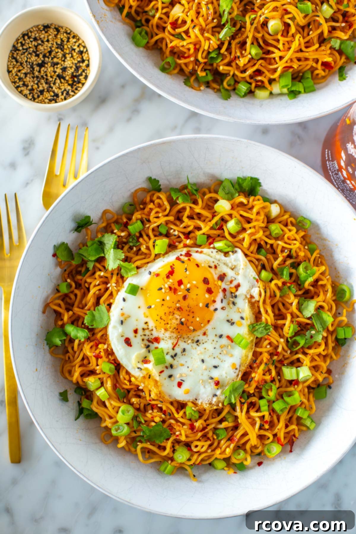 Quick Fiery Noodles 9 A vibrant bowl of spicy noodles, beautifully topped with a perfectly fried egg, fresh green onions, and fragrant cilantro.