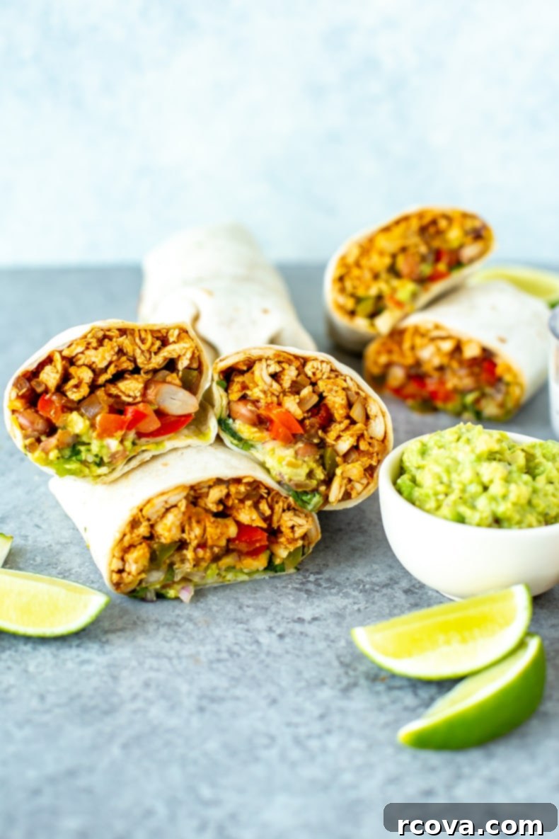 Quick Chicken Burrito Meal 10 A stack of beautifully wrapped Pulled Chicken Burritos, ready for meal prep or freezing, promising deliciousness later.