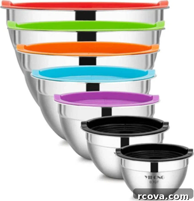 Ultimate Kitchen Setup 12 A set of stainless steel mixing bowls with different colored lids, perfect for meal prep and storage.
