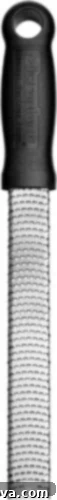 Ultimate Kitchen Setup 21 A microplane zester/grater with a black handle, for very fine grating.