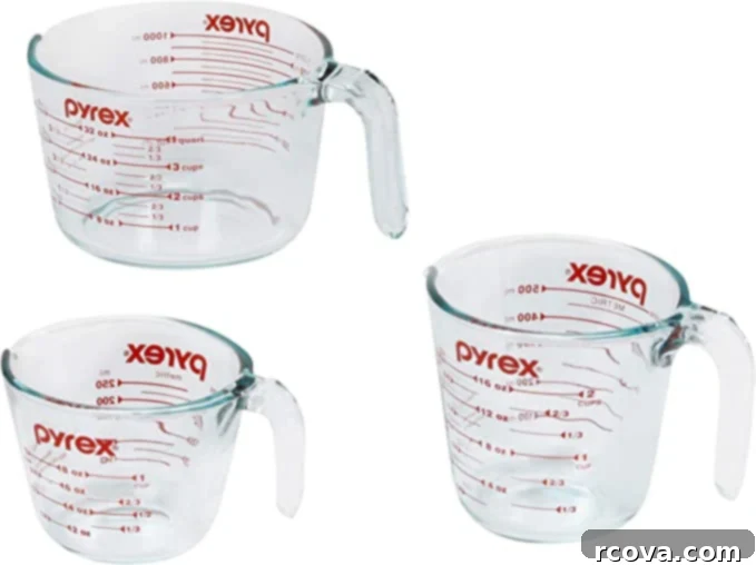 Ultimate Kitchen Setup 4 Three Pyrex liquid measuring cups, essential for accurate baking and cooking.