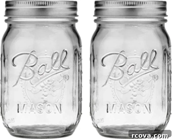 Ultimate Kitchen Setup 34 Two empty mason jars with lids on, highlighting their versatility for storage and mixing.