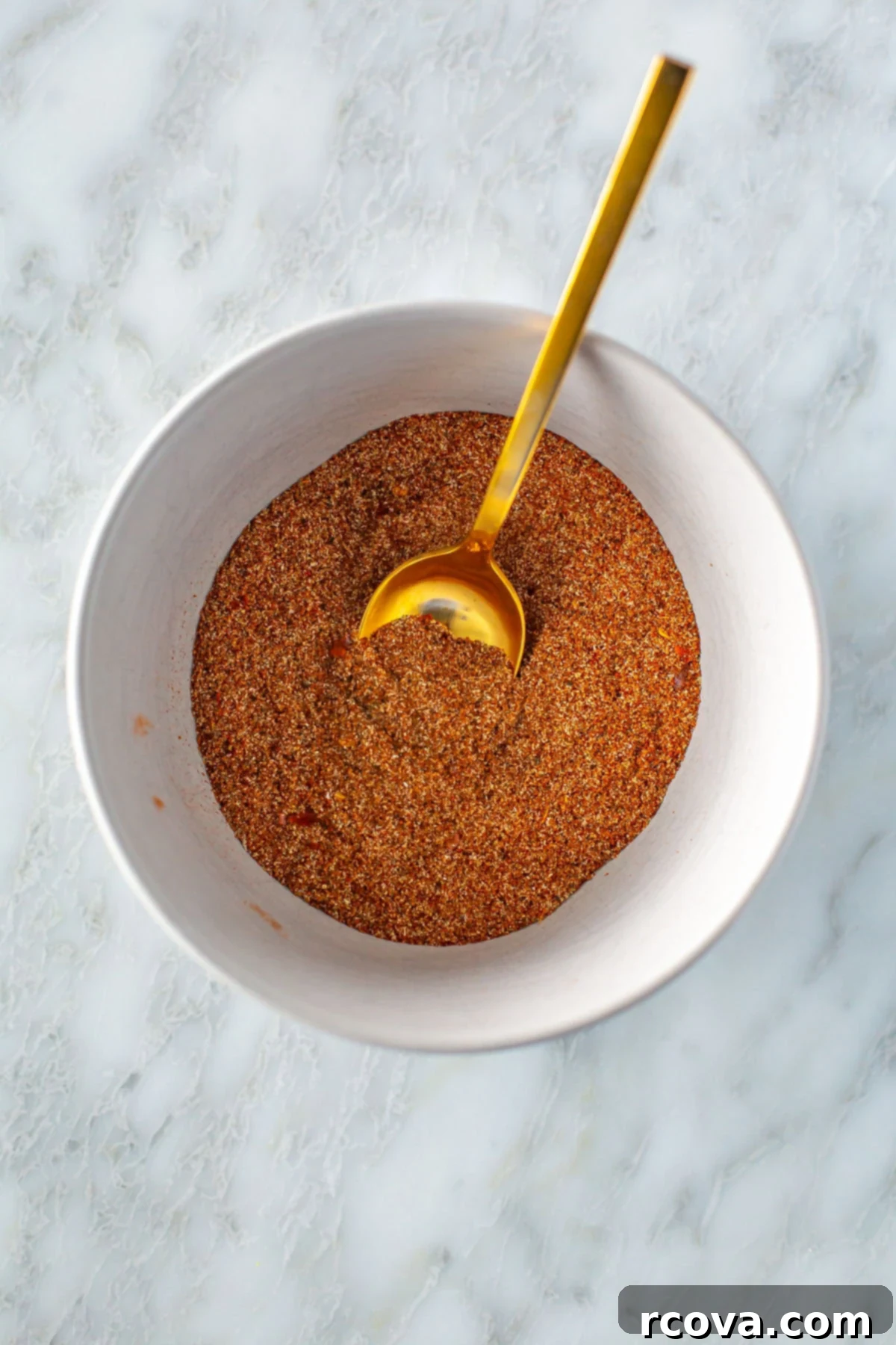 Simple Homemade Taco Seasoning And Jar Labels 6 Homemade taco seasoning mixed in a bowl with a spoon