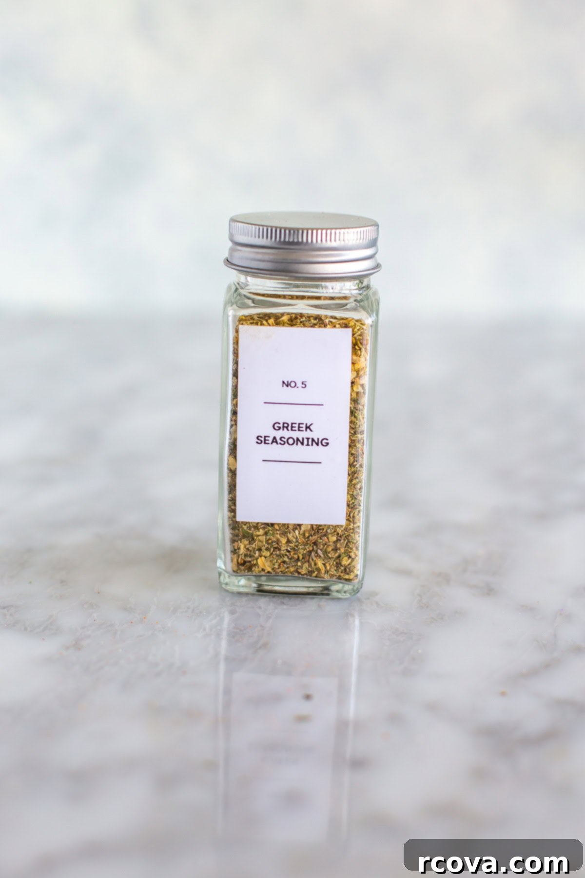 Effortless Greek Spice Blend 5 Greek seasoning blend in a sealed jar with a white label