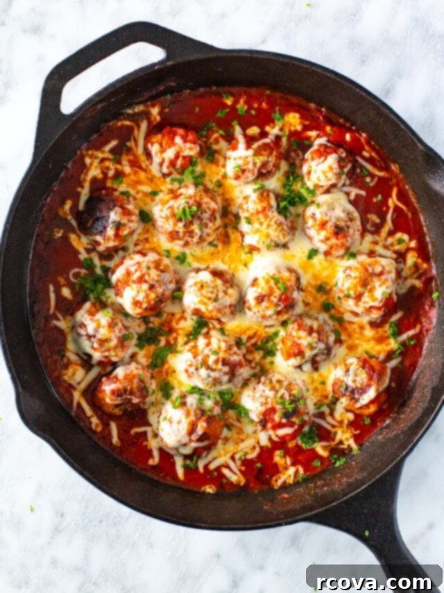35+ Healthy and Easy Recipes Under 500 Calories 35 A skillet filled with succulent chicken parm meatballs, generously topped with melted mozzarella cheese and simmering in marinara sauce.