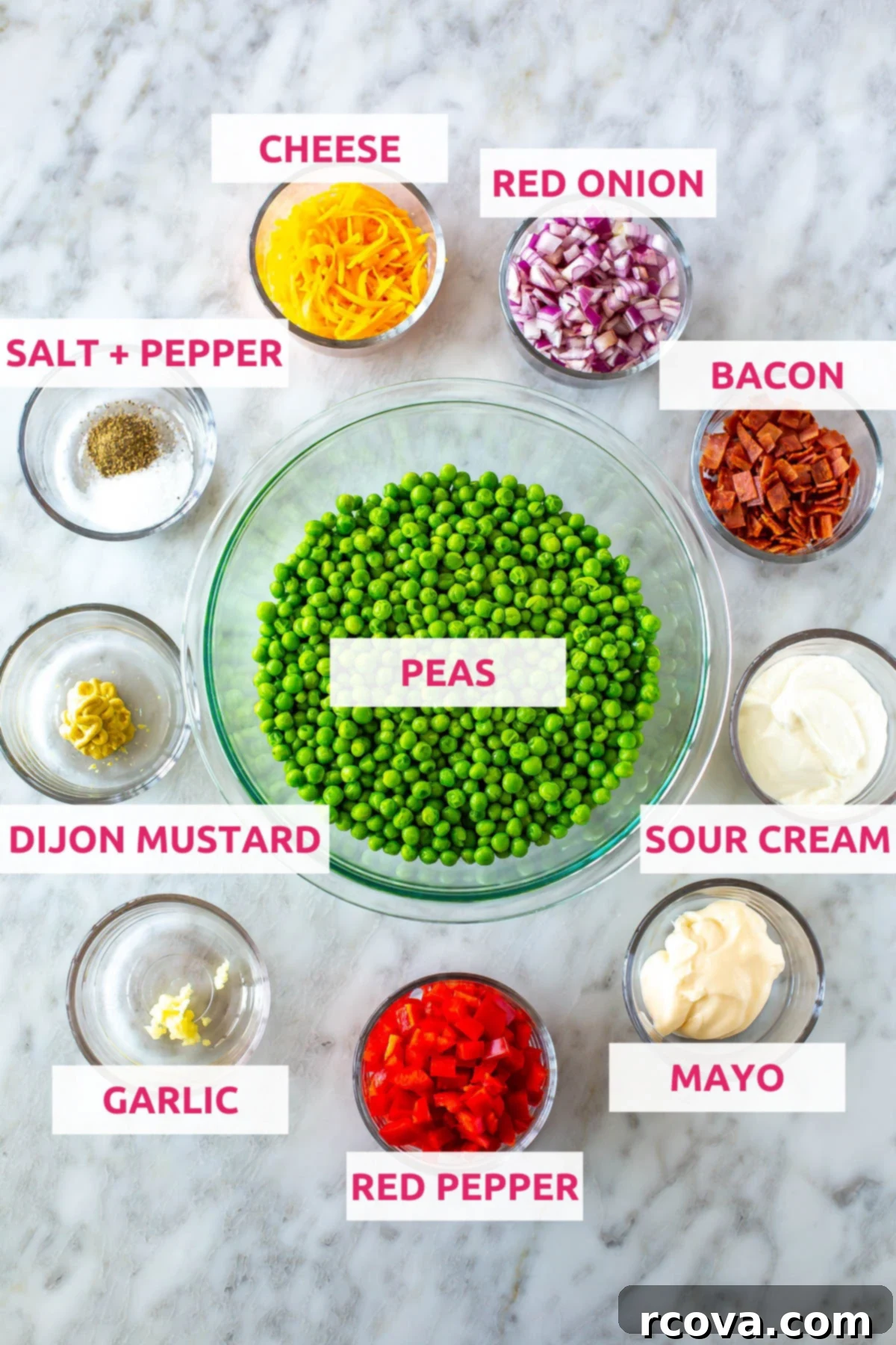Creamy Pea Salad Perfection 4 Ingredients for pea salad: peas, cheese, red onion, bacon, sour cream, mayo, red pepper, garlic, dijon mustard, salt and pepper.