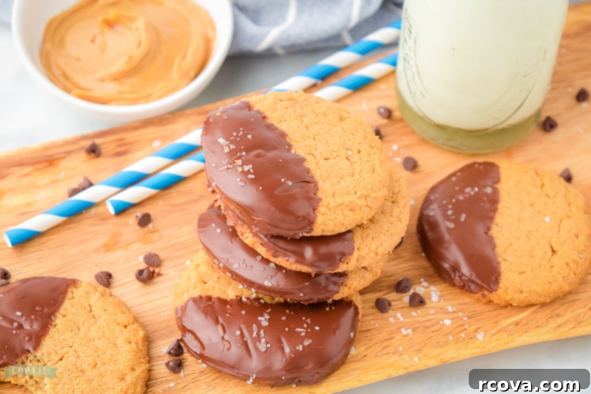 Irresistibly Chewy Peanut Butter Bliss 2 Chewy Peanut Butter Cookies dipped in chocolate, a delightful gluten-free treat.
