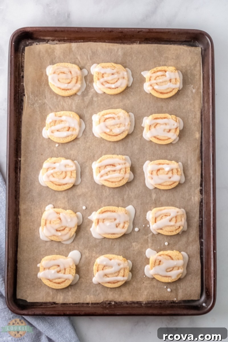 Cinnamon Bun Bliss Cookies 6 Close-up of cinnamon roll cookie dough being rolled into a log.