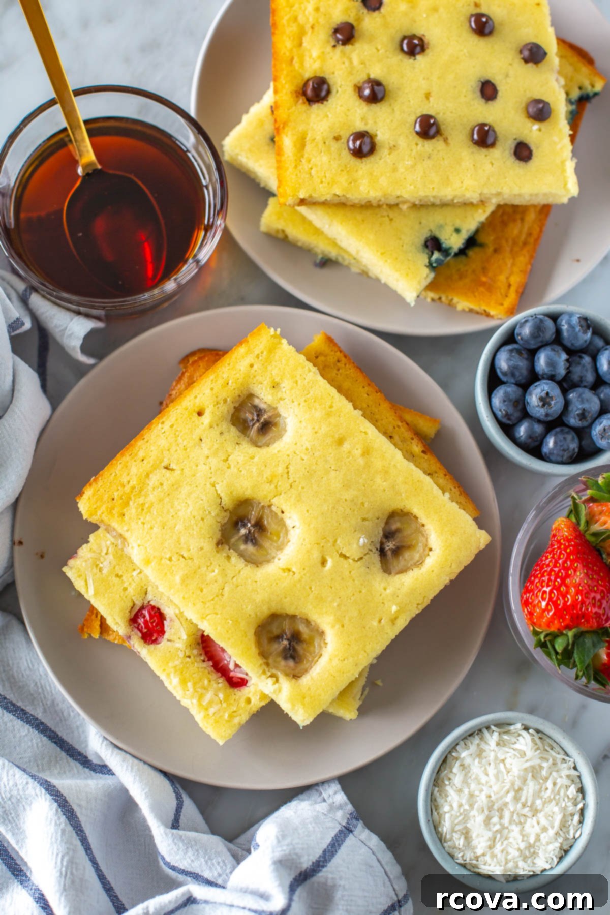 Sheet Pan Pancakes 4 Ways 9 A stack of golden sheet pan pancakes with maple syrup ready to be served, a perfect easy breakfast.