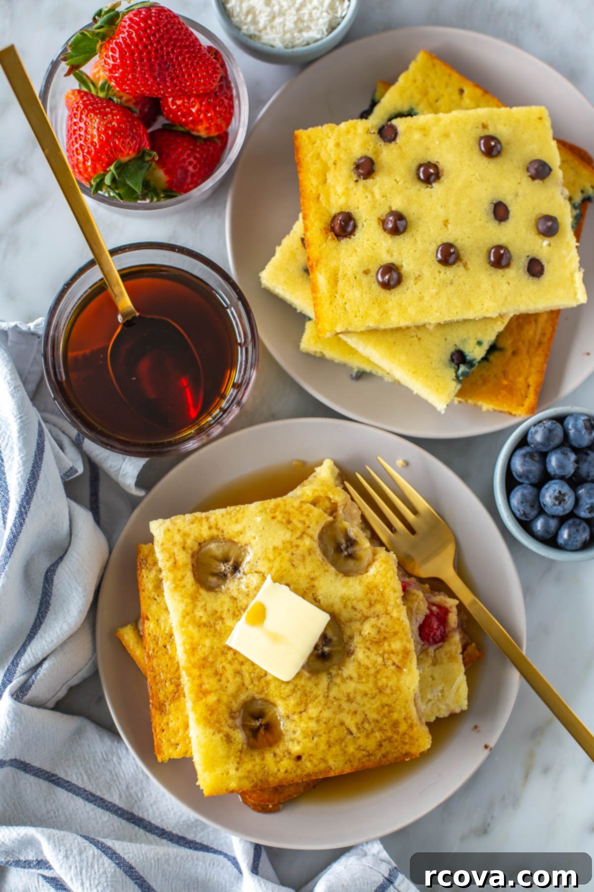Sheet Pan Pancakes 4 Ways 10 A stack of fluffy sheet pan pancakes, topped with a pat of butter and a drizzle of maple syrup.