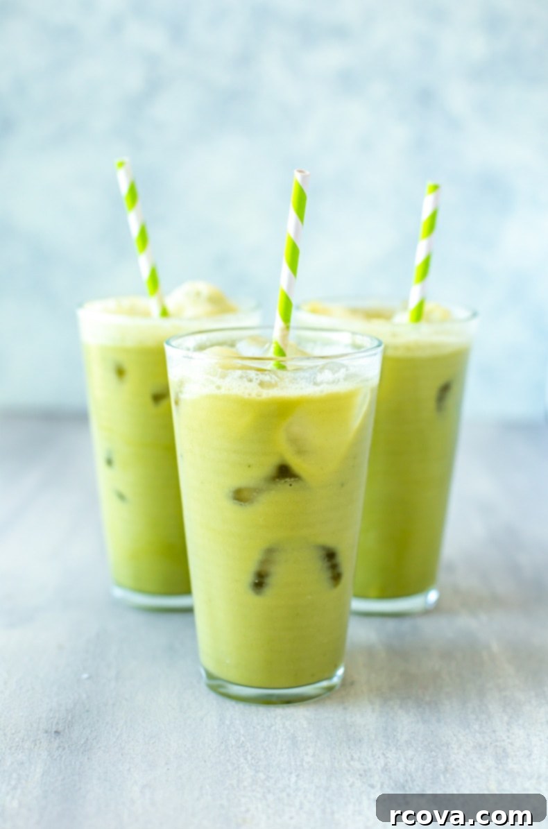 Make Your Own Starbucks Summer Drinks At Home 15 A glass of homemade Iced Pineapple Matcha Drink, showcasing its layered green and yellow colors.