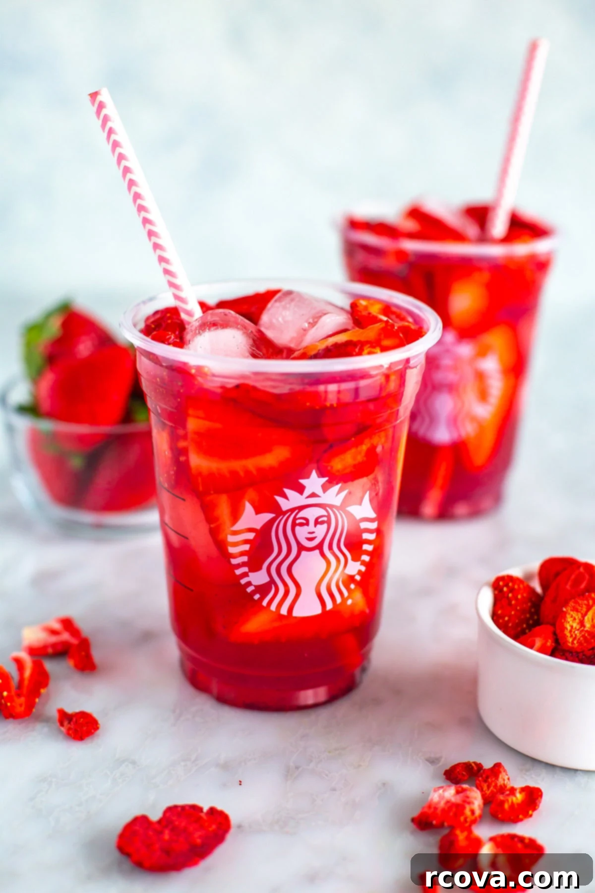 Make Your Own Starbucks Summer Drinks At Home 4 Two glasses of homemade Starbucks strawberry acai refresher.