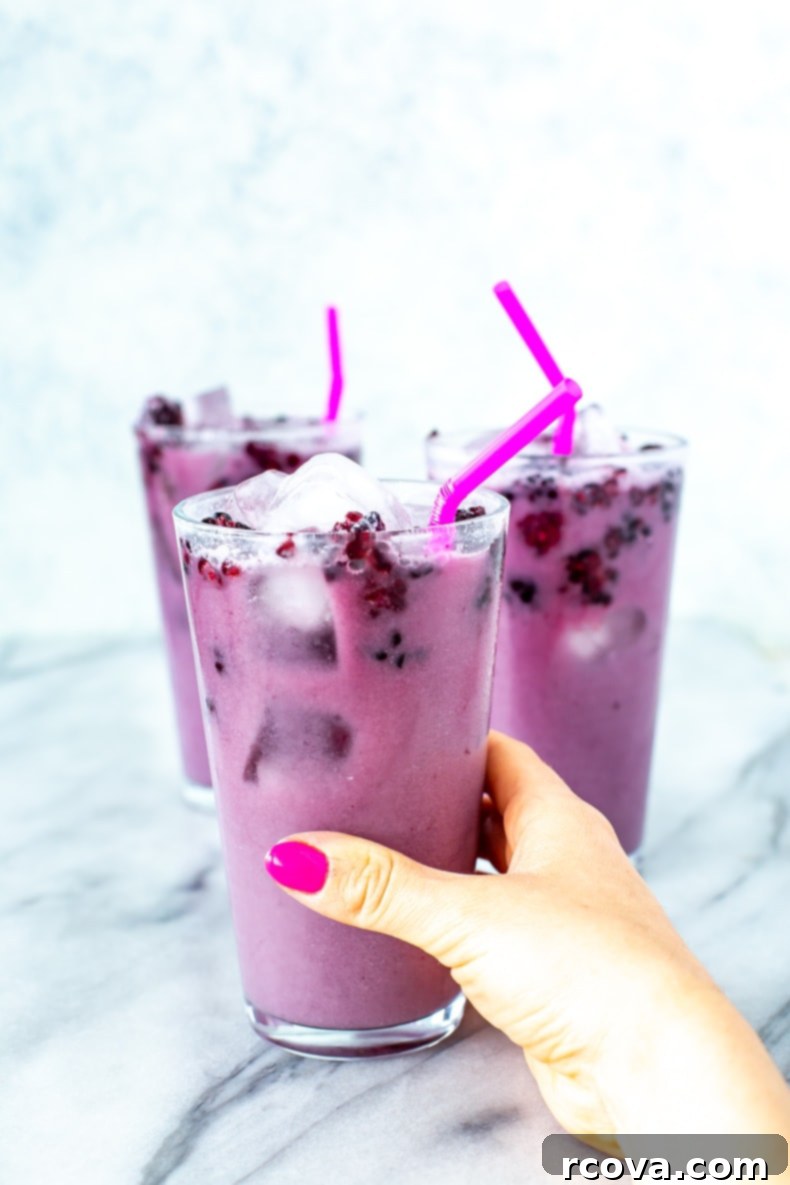 Make Your Own Starbucks Summer Drinks At Home 7 A glass of homemade Starbucks Violet Drink, showing its distinctive purple hue.