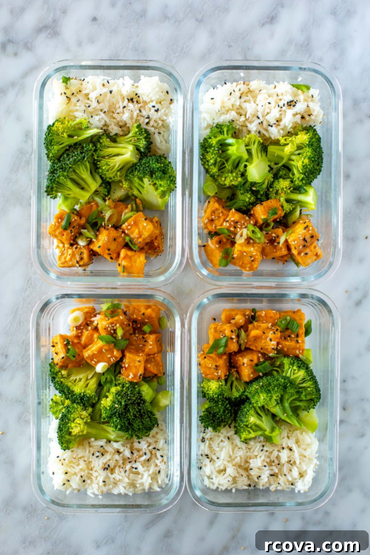 Master Crispy Air Fryer Tofu with Our Ultimate Sauce 10 Four meal prep containers, each with perfectly portioned rice, steamed broccoli, and crispy air fryer tofu, ready for the week.