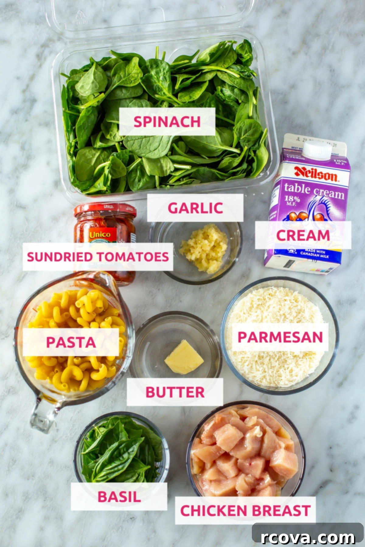 Effortless Creamy Sun-Dried Tomato Pasta 4 Fresh ingredients for creamy sundried tomato pasta including penne, diced chicken, sundried tomatoes, spinach, garlic, butter, cream, parmesan, and basil.
