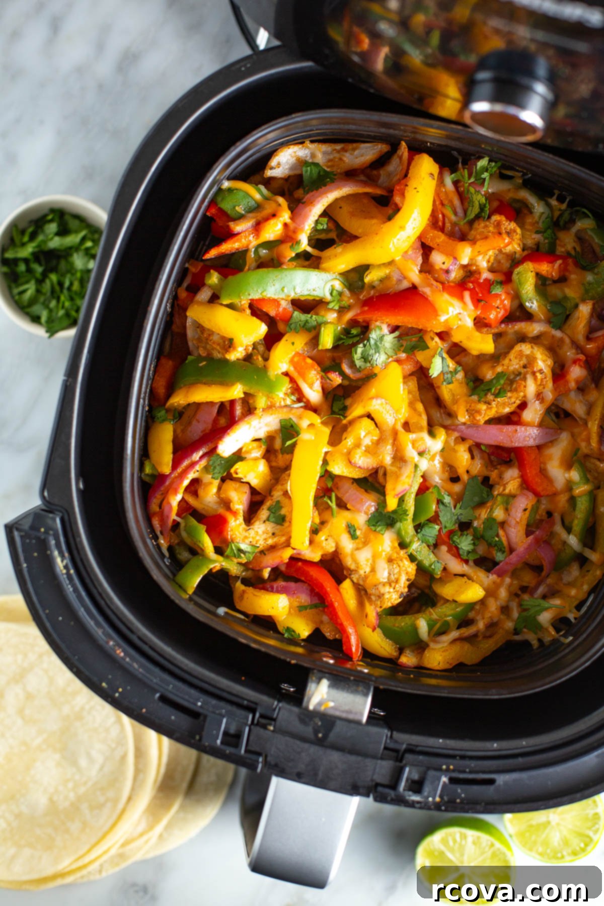 Effortless & Flavorful: 18 Air Fryer Delights 14 overhead shot of air fryer chicken fajitas in basket