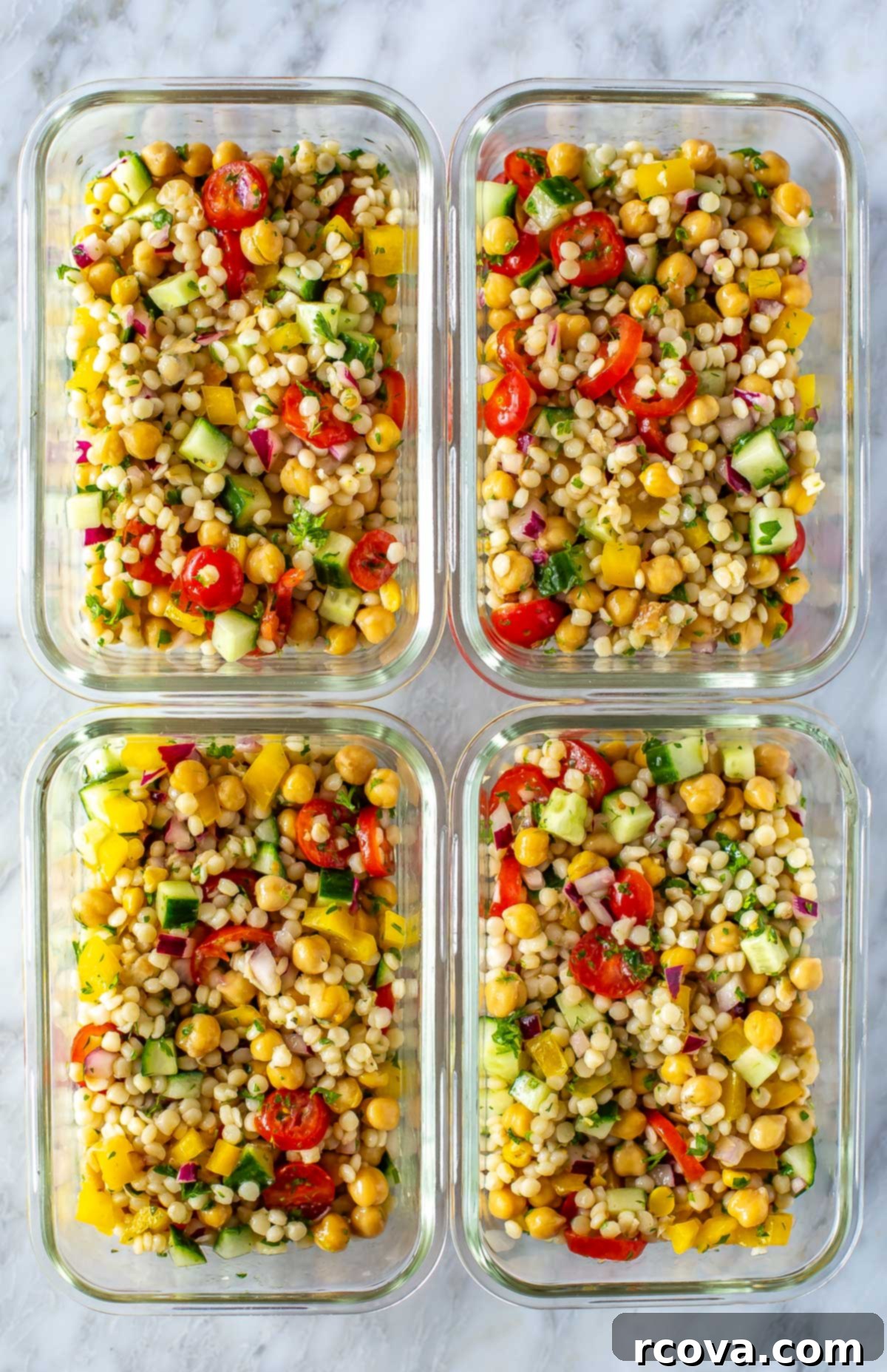 Effortless Mediterranean Couscous Salad for Meal Prep 8 Four perfectly portioned meal prep containers, each showcasing a serving of Mediterranean couscous salad, ready for the week.