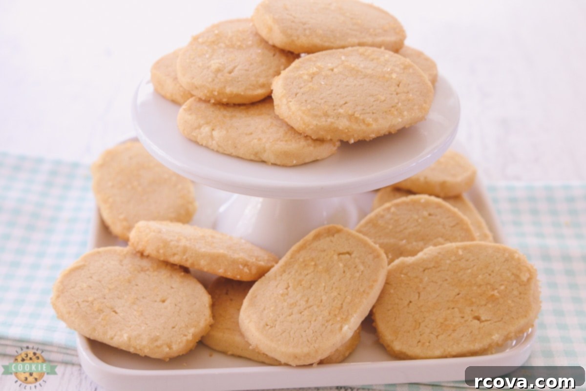 Effortless Vanilla Butter Delights 7 A collection of golden vanilla butter cookies piled on a plate, ready to be enjoyed.