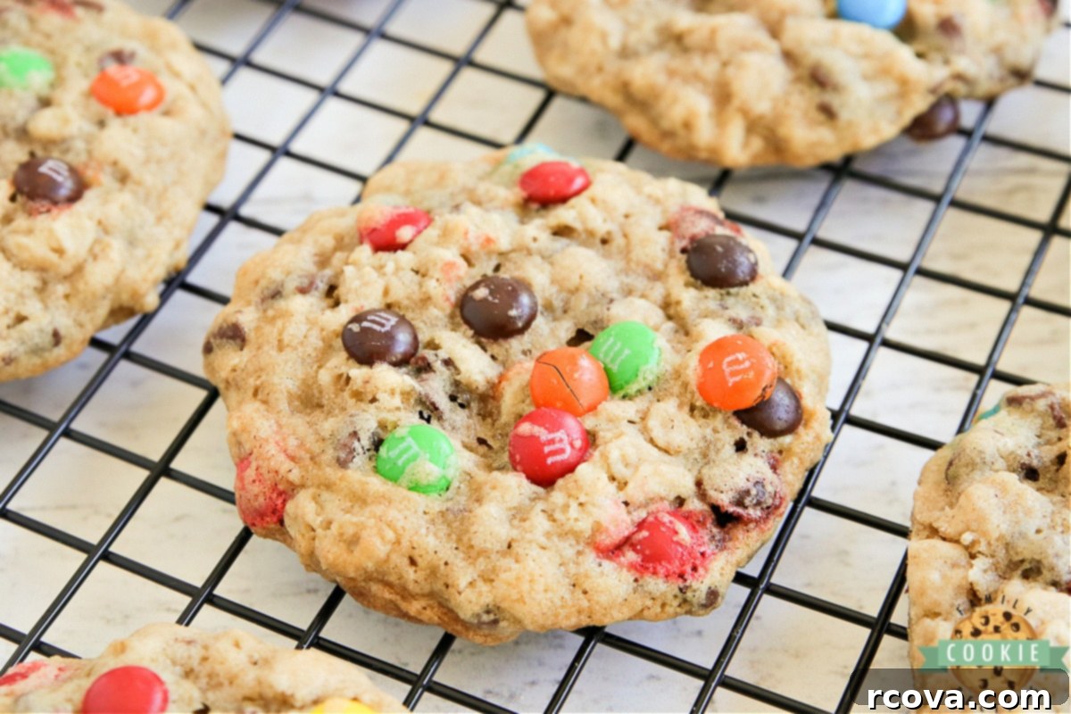 Colorful M and M Oatmeal Cookies 7 M&M Oatmeal Cookies stacked on a white plate, ready to be enjoyed.