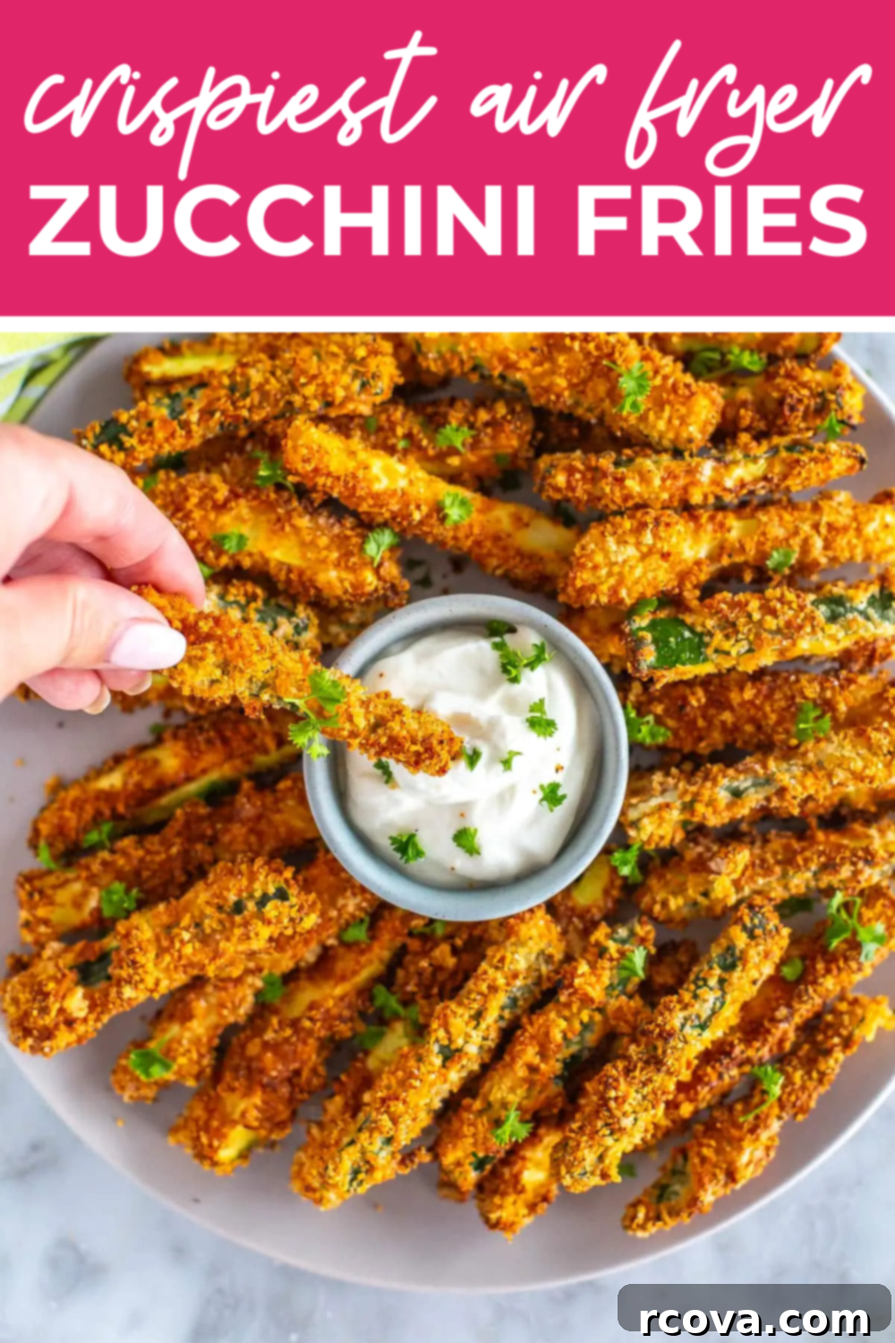 Perfectly Crispy Air Fryer Zucchini Fries 12 Zucchini fries on a platter with dip and the text "Crispy Air Fryer Zucchini Fries" on top.