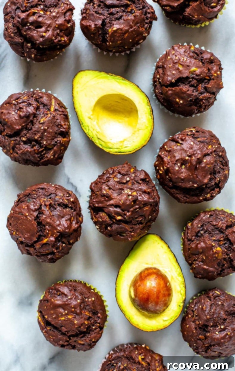 Guilt-Free Double Chocolate Zucchini Muffins 10 Freshly baked Healthy Double Chocolate Zucchini Muffins cooling on a rack.