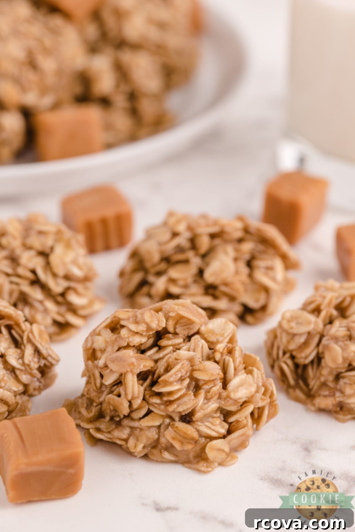 Dreamy Caramel Oat No Bake Bites 2 Close-up of freshly made Caramel Oatmeal No Bake Cookies cooling on wax paper, highlighting their golden brown color and chewy texture.