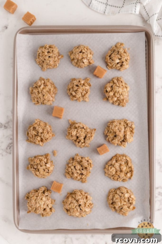 Dreamy Caramel Oat No Bake Bites 6 A plate of finished Caramel Oatmeal No Bake Cookies with a glass of milk in the background, showcasing their inviting texture.