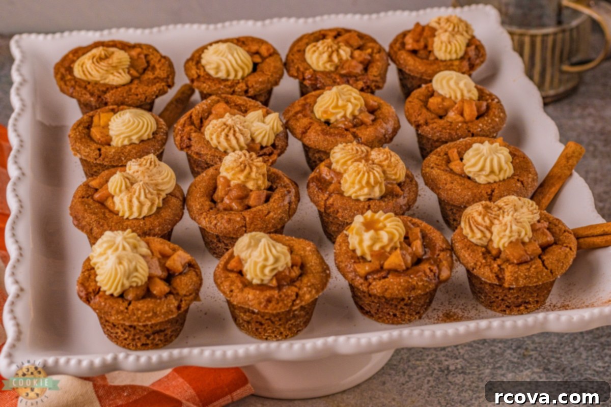 Warm Spiced Caramel Apple Gingerbread Cookies 3 Overhead shot of several caramel apple gingerbread cookies on a cooling rack, showing their neat cup shape.