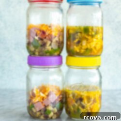 Microwave Omelette Meal Prep 10 Four mason jars with microwave omelettes inside.