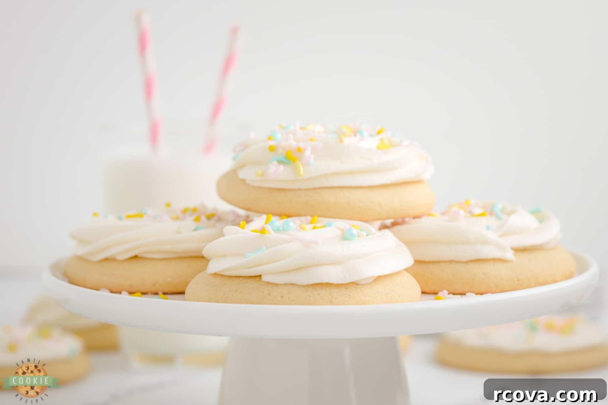 Pillowy Soft Sugar Cookies 6 sugar cookies on a cake stand, waiting to be frosted