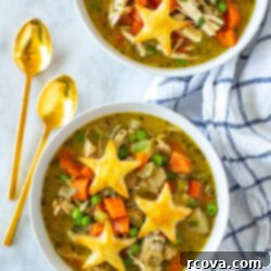 Wholesome Chicken Pot Pie Soup 11 Two bowls of chicken pot pie soup, a comforting and healthy meal.