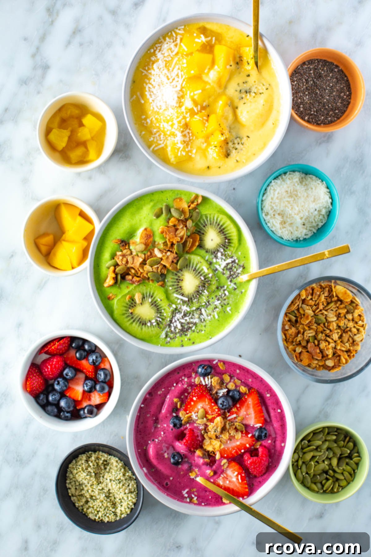 Whip Up Amazing Smoothie Bowls 7 A trio of colorful and delicious smoothie bowls: a sunny yellow tropical blend, a vibrant green spinach-based bowl, and a rich pink berry concoction, all generously adorned with a variety of healthy toppings.