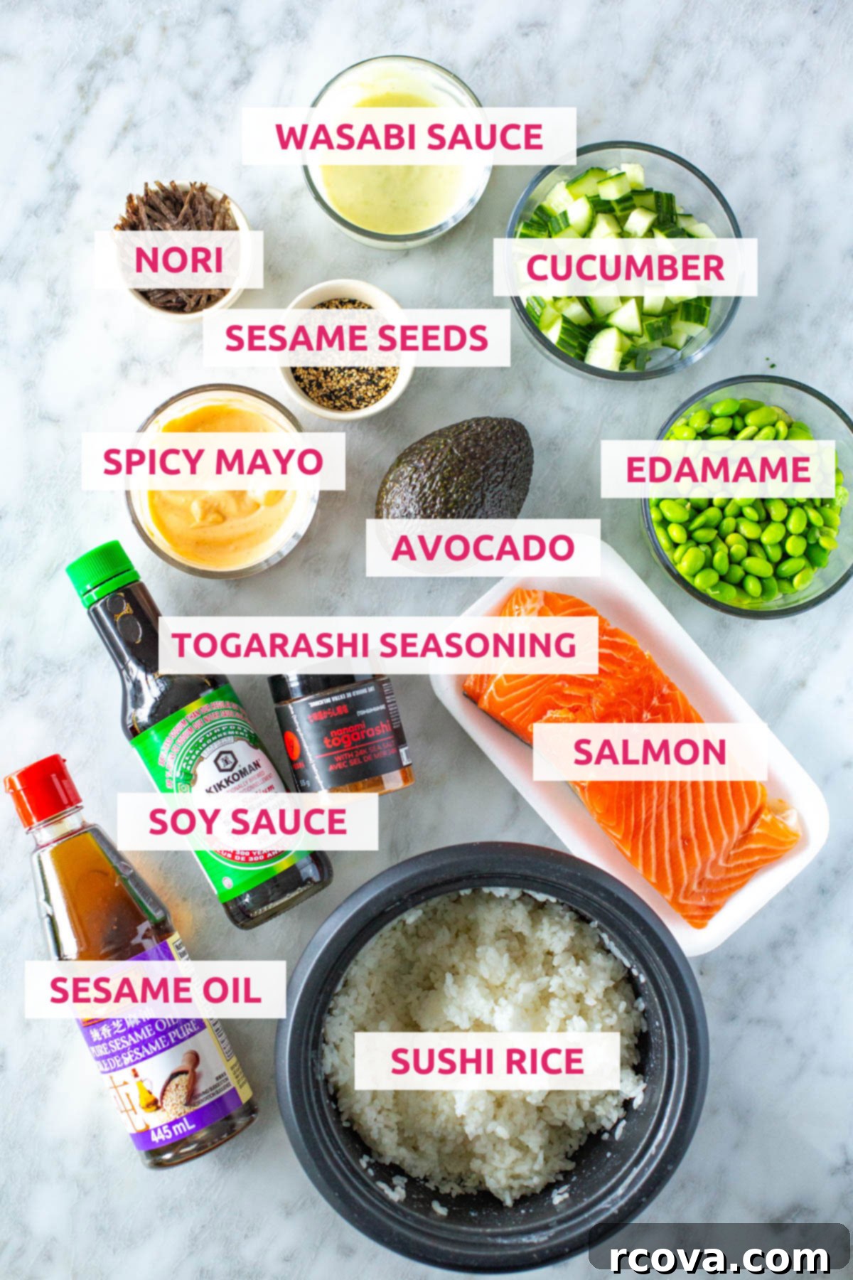 Effortless Spicy Salmon Sushi Bowls 4 All ingredients for homemade spicy salmon sushi bowls laid out: sushi rice, salmon, sesame oil, soy sauce, togarashi seasoning, avocado, spicy mayo, wasabi sauce, nori, sesame seeds, cucumber and edamame.