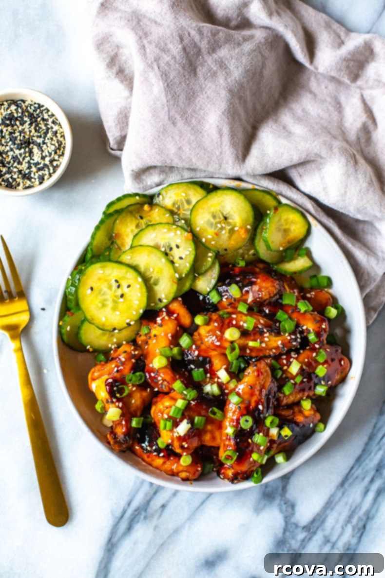 Korean Sticky Oven Wings 2 Irresistible Baked Korean Chicken Wings served with a refreshing cucumber salad