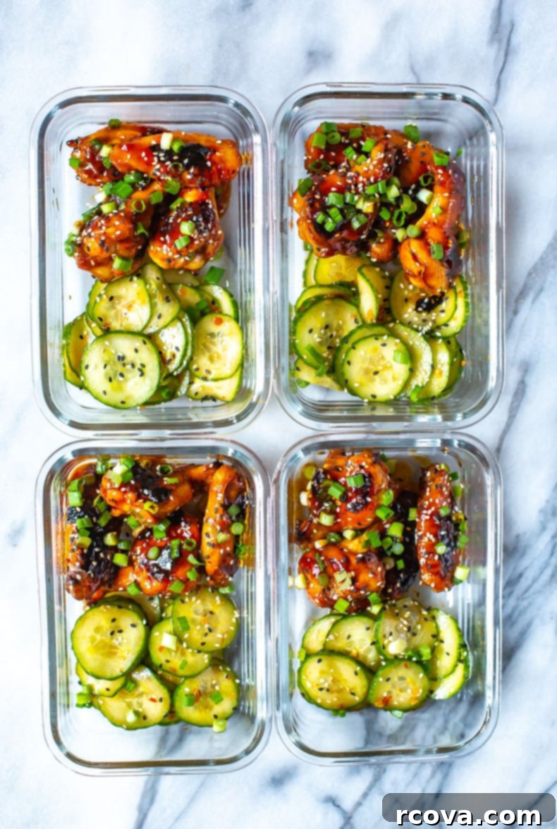 Korean Sticky Oven Wings 10 A selection of Korean Chicken Wings in a bowl with a side of refreshing cucumber salad
