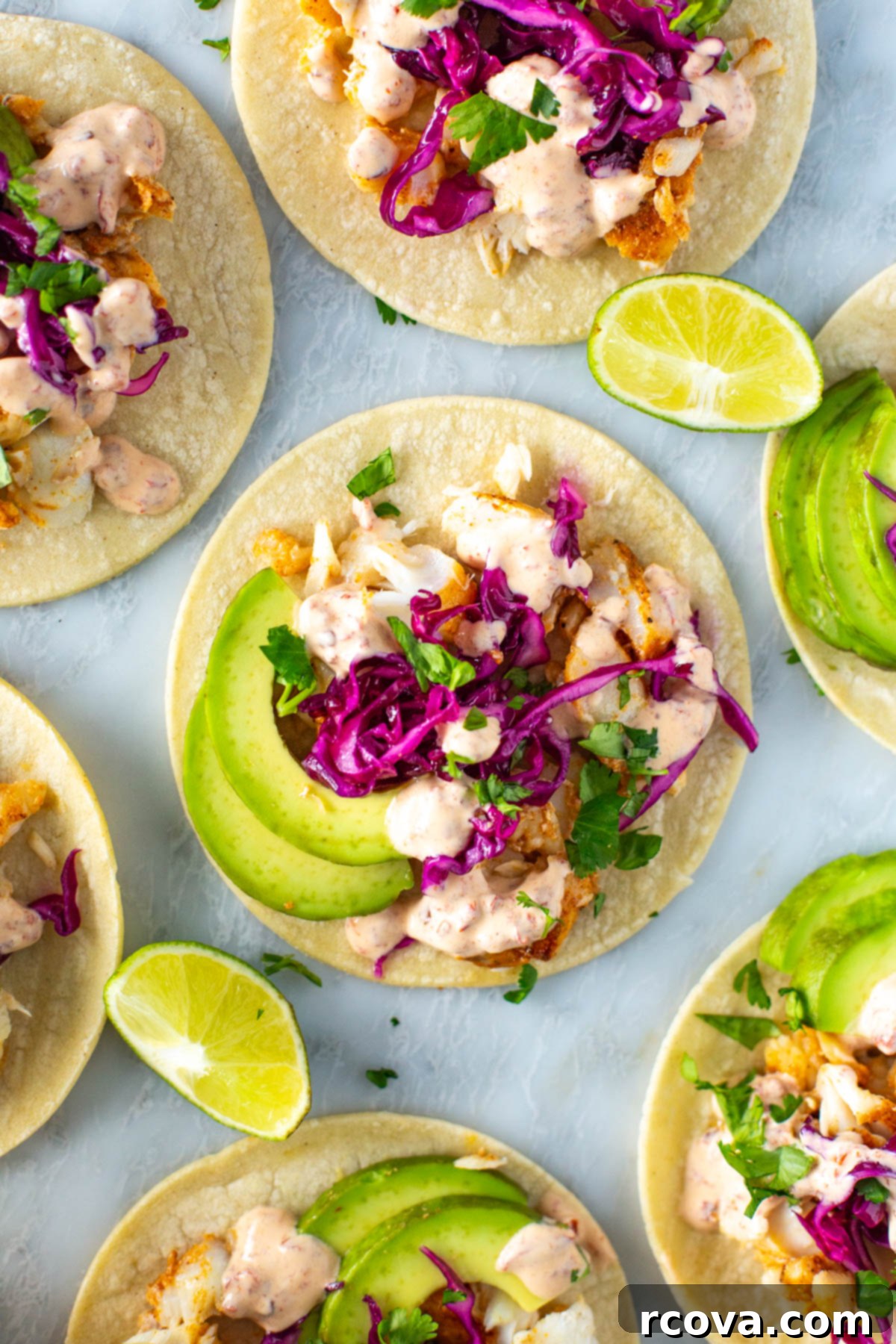 No-Fuss Fish Tacos 8 A close-up of homemade fish tacos with chipotle crema on top.