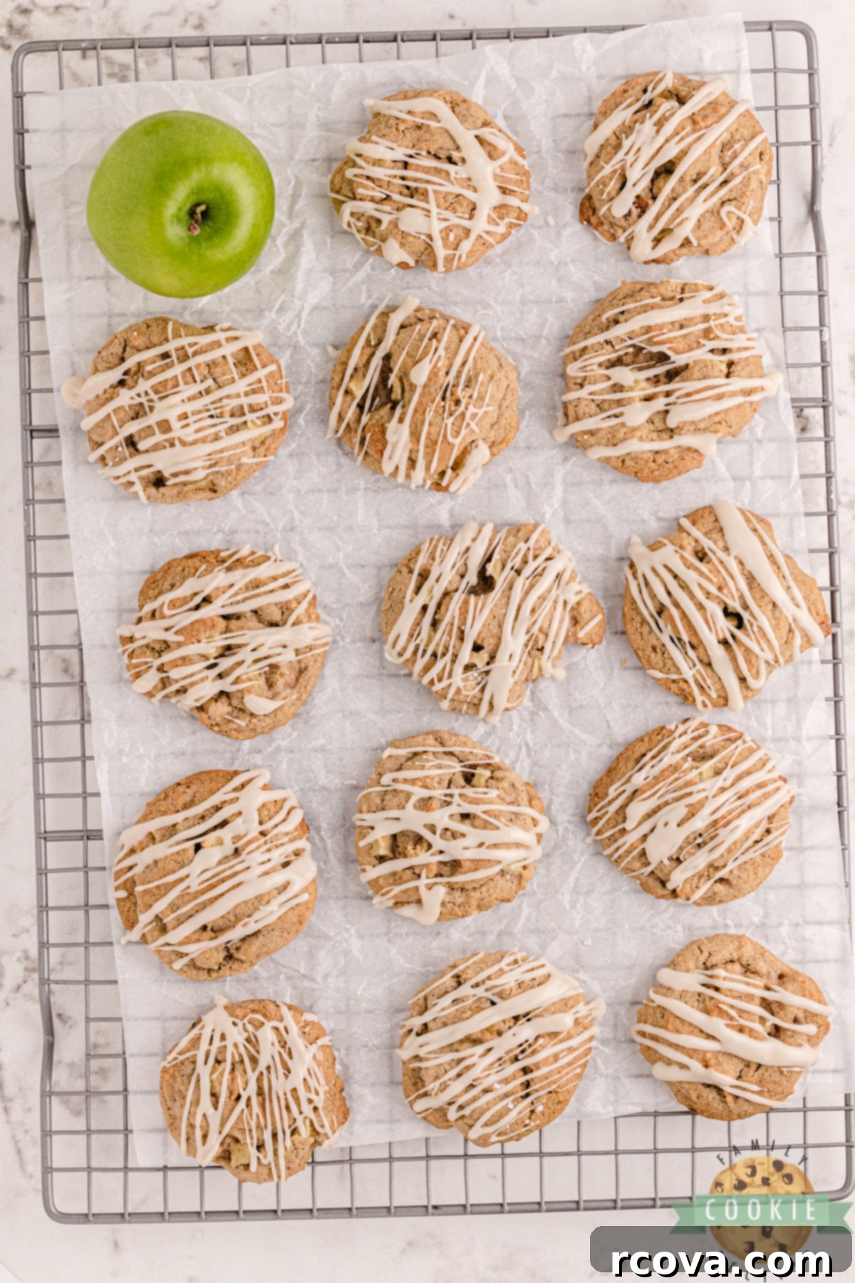 Vanilla Kissed Spiced Apple Treats 5 Close up of apple cookies with a sweet vanilla glaze drizzled over them, highlighting the texture and topping.