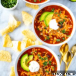 Effortless Southwest Chili 10 Three bowls of southwest chili topped with sour cream.