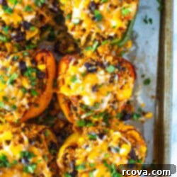 Garden Stuffed Bell Peppers 10 Vegetarian stuffed peppers on a sheet pan.