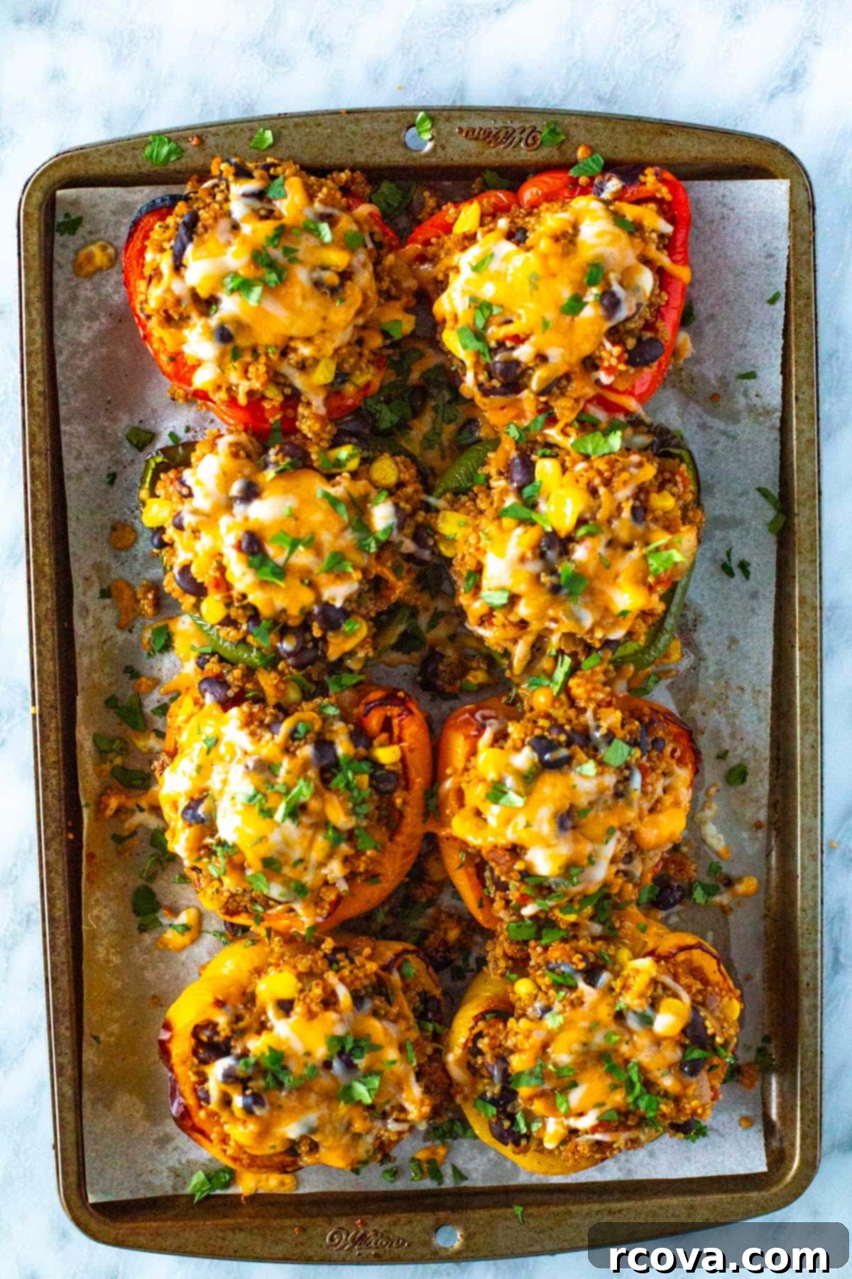 Garden Stuffed Bell Peppers 7 Vegetarian stuffed peppers on a sheet pan.