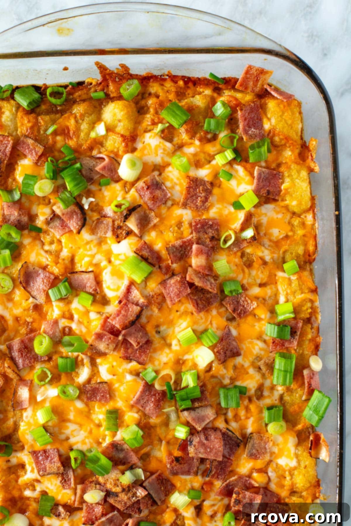 Crunchy Morning Casserole 9 A close-up shot of the Tater Tot Breakfast Casserole, showing the golden-brown tater tots and melted cheese.