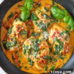 Luxurious Marry Me Chicken 11 A skillet of marry me chicken, garnished with fresh basil.